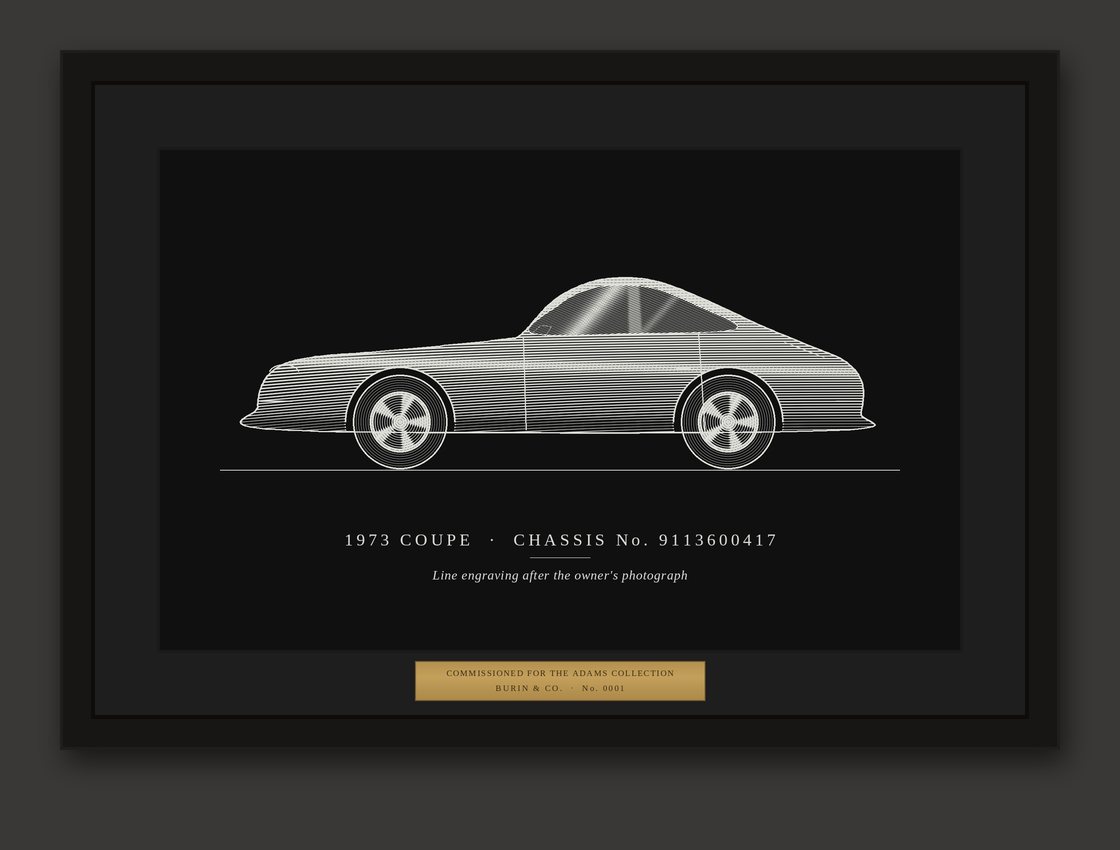 A framed silver-on-black engraving of a classic coupe with a brass plaque